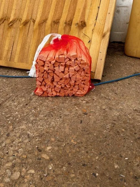 A net bag of softwood kindling